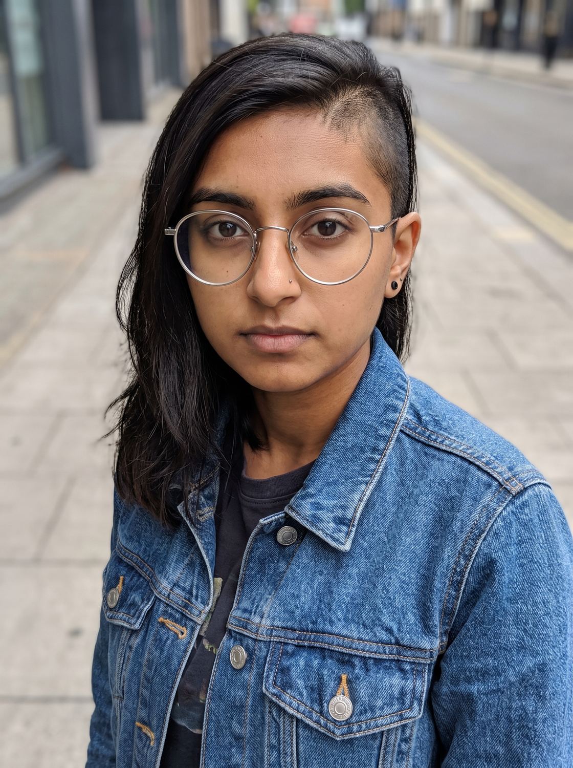 Priya, one of four friends, seen on a pavement.